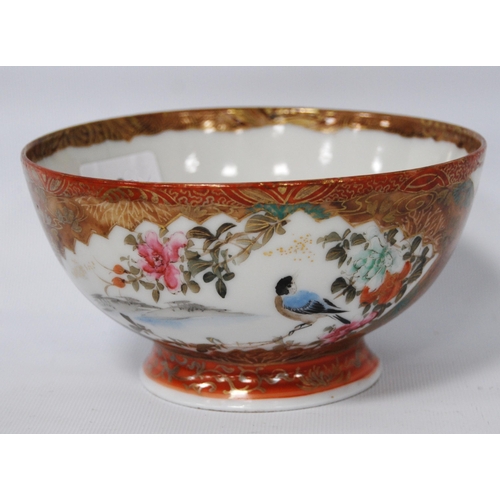 196 - Japanese Kutani bowl in typical colours, decorated with panels of birds and floral sprays to the wel... 