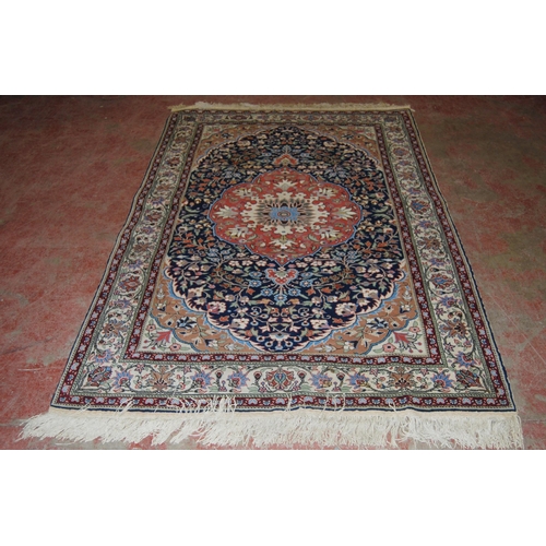 411 - Persian Tabriz hand-knotted rug with large foliate medallion to the centre within all over foliage, ... 