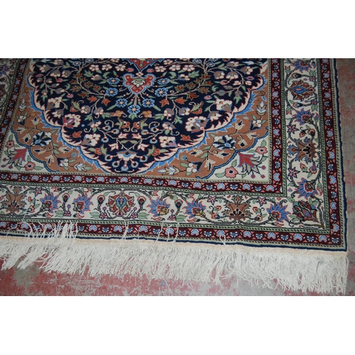 411 - Persian Tabriz hand-knotted rug with large foliate medallion to the centre within all over foliage, ... 