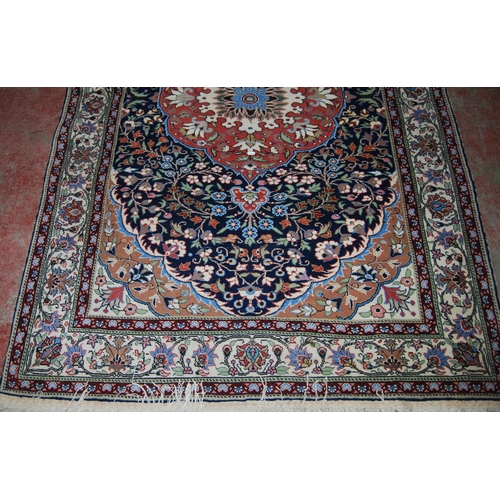 411 - Persian Tabriz hand-knotted rug with large foliate medallion to the centre within all over foliage, ... 