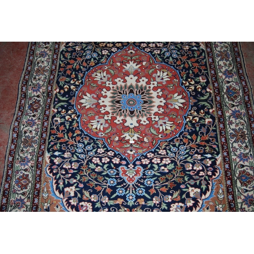 411 - Persian Tabriz hand-knotted rug with large foliate medallion to the centre within all over foliage, ... 