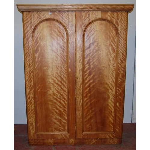 419 - Victorian satinwood wardrobe, the moulded cornice above two doors enclosing open and closed drawers,... 