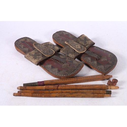 102 - Pair of Eastern leather and stitched thread sandals, 27cm long, a Chinese style two section carved b... 