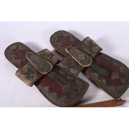 102 - Pair of Eastern leather and stitched thread sandals, 27cm long, a Chinese style two section carved b... 