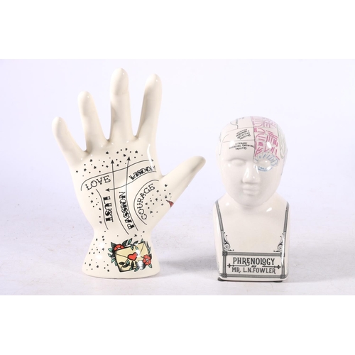 106 - Three reproduction palmistry hands and a reproduction L N Fowler phrenology head.  (4)