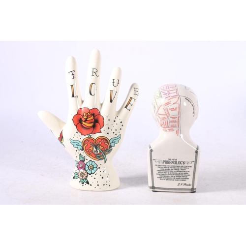 106 - Three reproduction palmistry hands and a reproduction L N Fowler phrenology head.  (4)