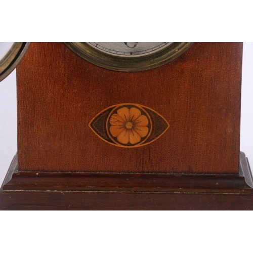 108 - Mahogany cased arch-top mantel clock decorated with faux inlaid flower to front, 30cm high.