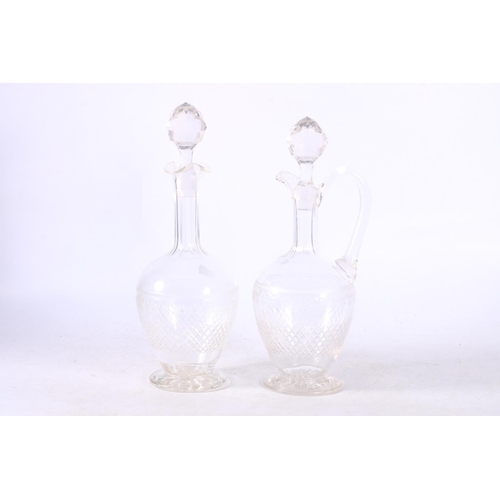 110 - Two cut and etched glass decanters.