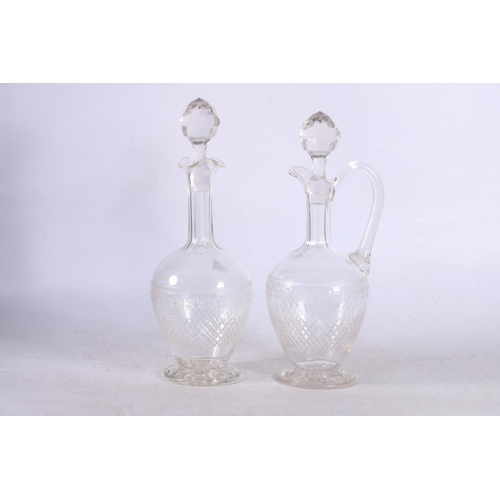 110 - Two cut and etched glass decanters.