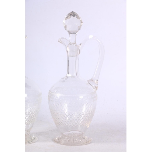 110 - Two cut and etched glass decanters.