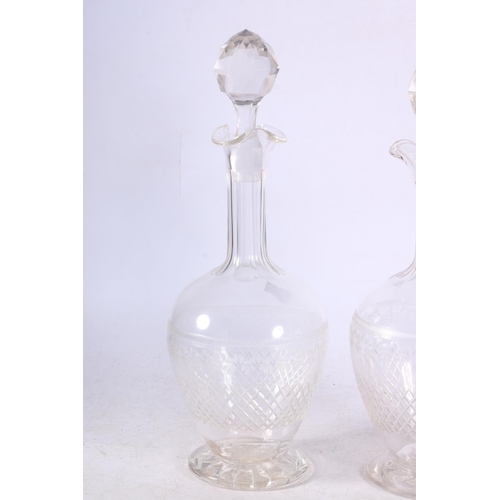 110 - Two cut and etched glass decanters.