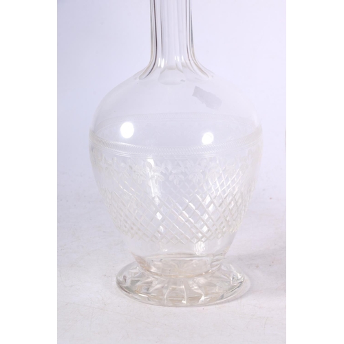 110 - Two cut and etched glass decanters.