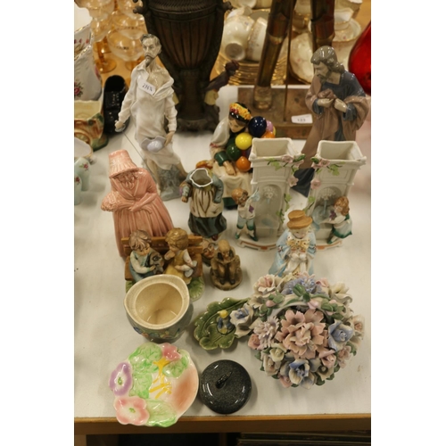 122 - Decorative ceramics to include a Nao figurine, a miniature curling stone, a floral posy, etc.