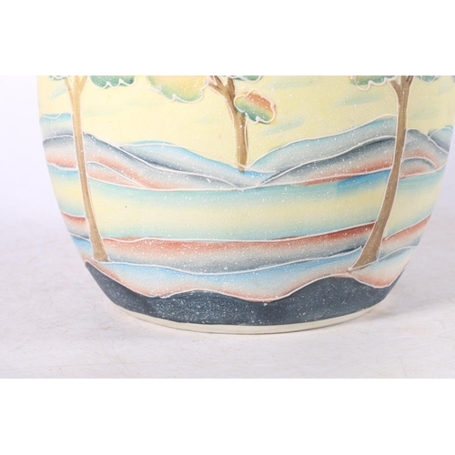 135 - Italian Art Pottery vase decorated with colour trees in a landscape, 27cm high.