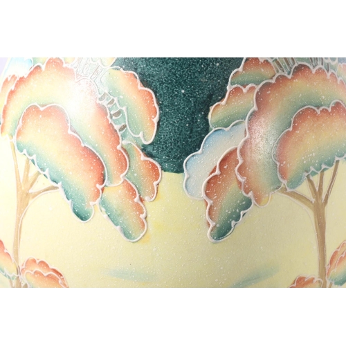 135 - Italian Art Pottery vase decorated with colour trees in a landscape, 27cm high.