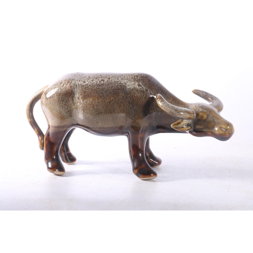 15 - Two ceramic buffalo models.