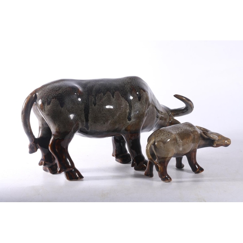 15 - Two ceramic buffalo models.