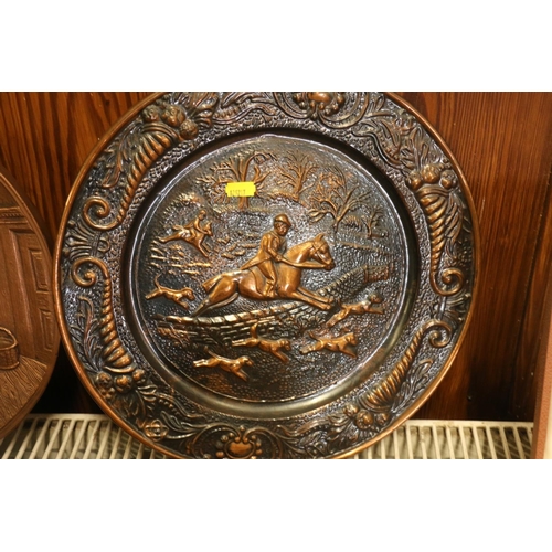 158 - Two brass wall plaque, and a bronzed plaster wall plaque.