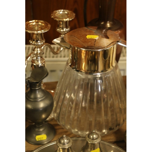 159 - Metal and brass ware to include a three branch candelabra, a silver-plate and glass water jug, etc.