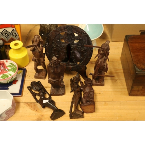 167 - Southeast Asian/Indonesian carved wooden items to include a wall plaque, tribal figures, etc.