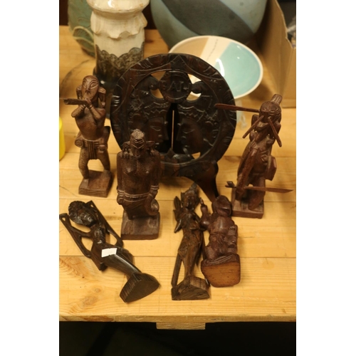 167 - Southeast Asian/Indonesian carved wooden items to include a wall plaque, tribal figures, etc.