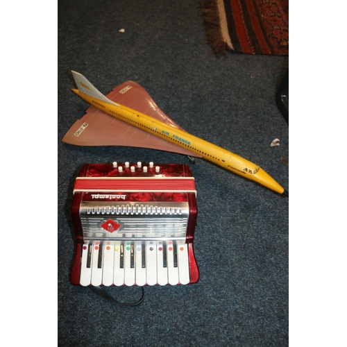 209 - Child's Bontempi battery operated accordion, and a Sanchis of Spain model of Concorde.