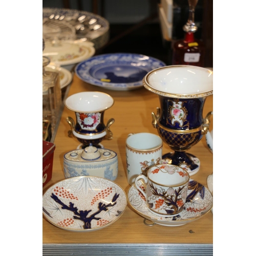 217 - Antique English porcelain campagna urn decorated with flowers on royal blue ground, another smaller,... 