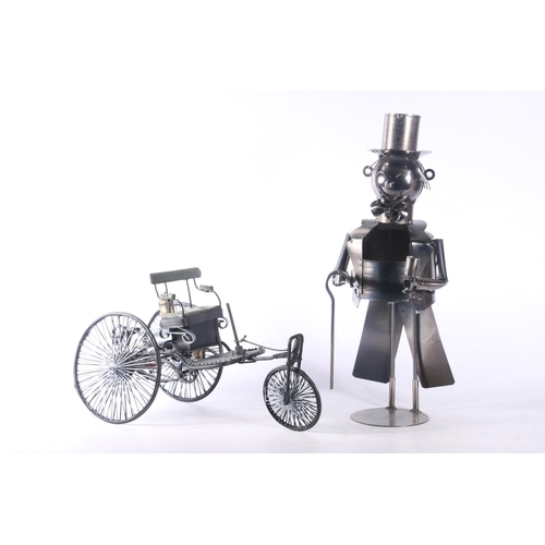 25 - Novelty wine bottle holder in the form of a gentleman in tuxedo and top hat, and a model of an early... 