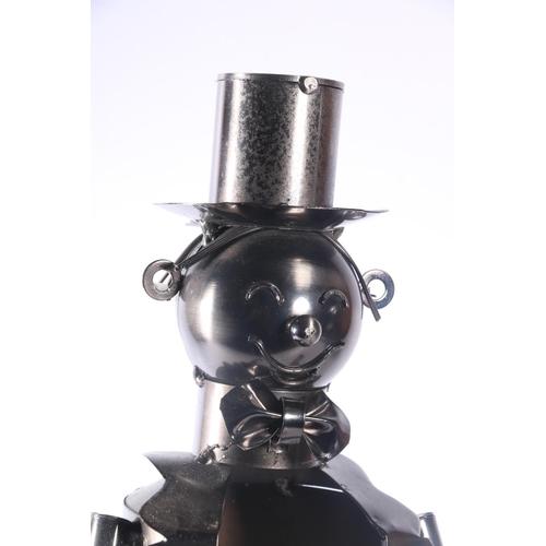 25 - Novelty wine bottle holder in the form of a gentleman in tuxedo and top hat, and a model of an early... 