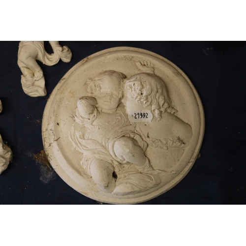 30 - Three plaster cast cherubs, largest 30cm wide.