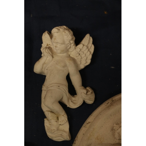 30 - Three plaster cast cherubs, largest 30cm wide.