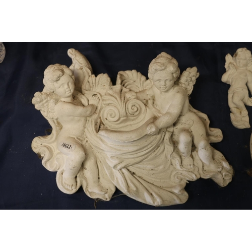 30 - Three plaster cast cherubs, largest 30cm wide.