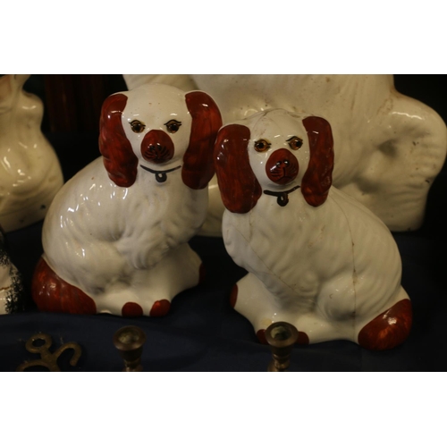 35 - Four wally dogs and a Staffordshire style model of a boy standing, 34cm high.