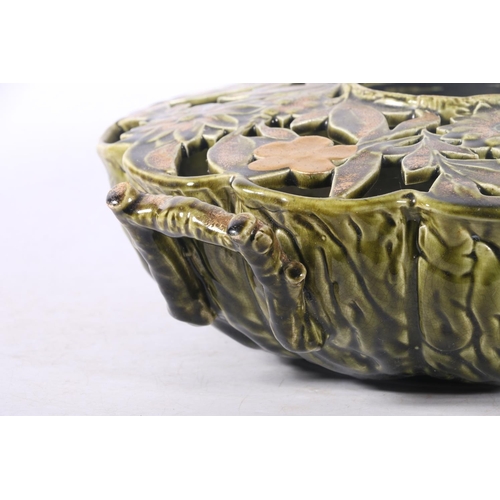 38 - Eastern European reticulated ceramic centrepiece decorated with cabbage leaf bottom and floral top, ... 