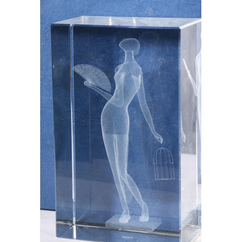 46 - Lafeye glass block internal 3D dot sculpture of a lady with fan, together with a similar presentatio... 