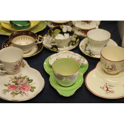 53 - Cabinet cups to include Crown Devon Stockholm, a breakfast set, Carlton ware to include Vert Royale,... 