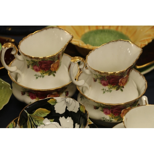 53 - Cabinet cups to include Crown Devon Stockholm, a breakfast set, Carlton ware to include Vert Royale,... 