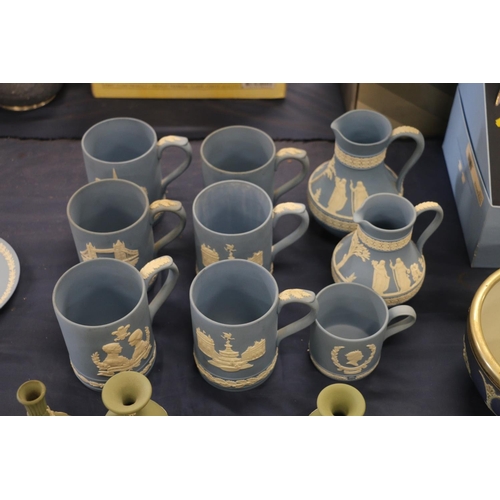 65 - Wedgwood Jasper Ware to include six tankards, two water jugs, and a smaller commemorative cup.