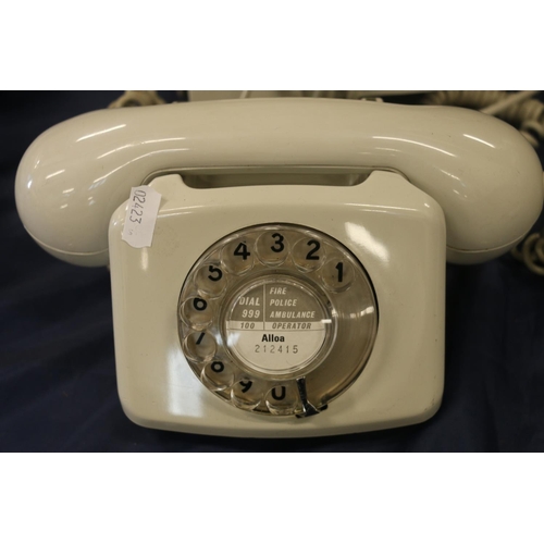 76 - Two vintage telephones.