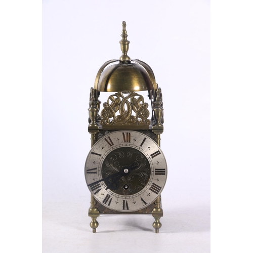 78 - Brass lantern clock decorated with pierced panels depicting dolphins amongst sea foliage, 29cm.