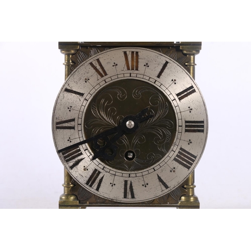 78 - Brass lantern clock decorated with pierced panels depicting dolphins amongst sea foliage, 29cm.