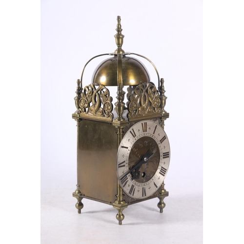 78 - Brass lantern clock decorated with pierced panels depicting dolphins amongst sea foliage, 29cm.