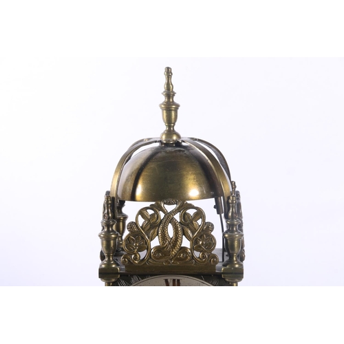 78 - Brass lantern clock decorated with pierced panels depicting dolphins amongst sea foliage, 29cm.