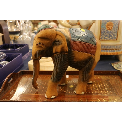 85 - Carved treen model of an elephant, 28cm high.