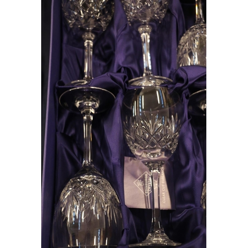 86 - Six Edinburgh Crystal wine glasses, boxed, and two Edinburgh Crystal champagne flutes, also boxed.