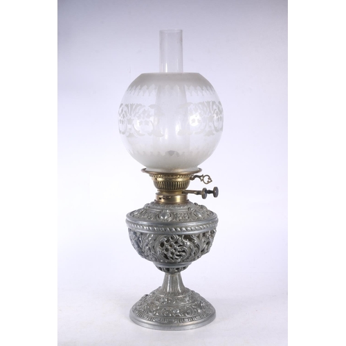 9 - David Foulis of Edinburgh cast metal and glass oil lamp, decorated with repousse masks and scrolls, ... 