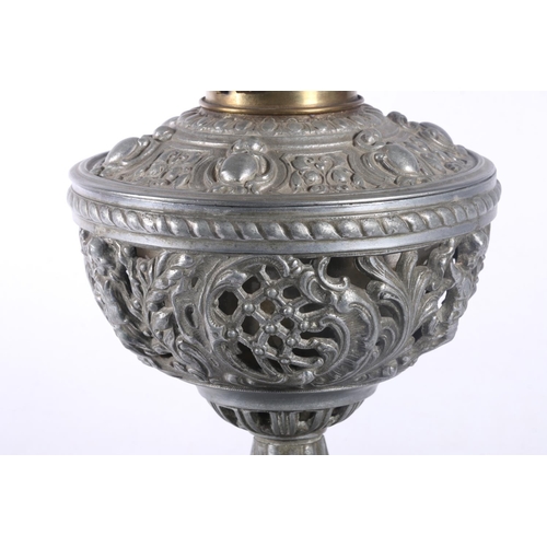 9 - David Foulis of Edinburgh cast metal and glass oil lamp, decorated with repousse masks and scrolls, ... 