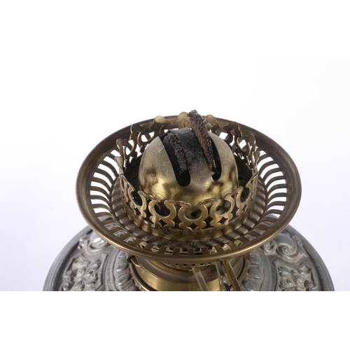 9 - David Foulis of Edinburgh cast metal and glass oil lamp, decorated with repousse masks and scrolls, ... 