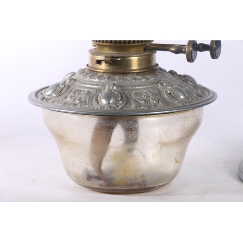 9 - David Foulis of Edinburgh cast metal and glass oil lamp, decorated with repousse masks and scrolls, ... 