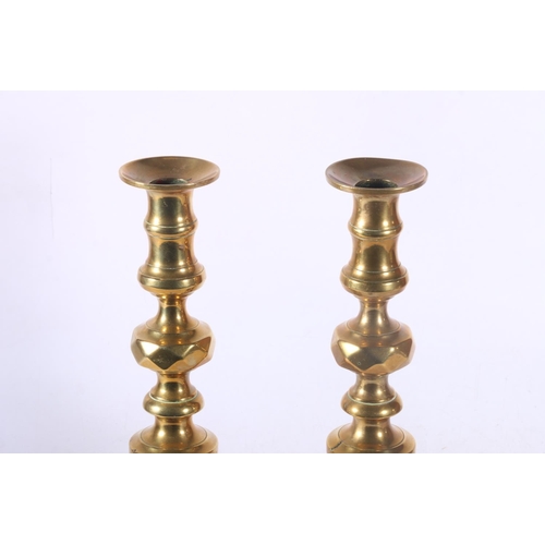 92 - Pair of brass candlesticks.